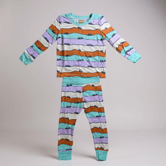 Children's pajama set with colorful striped pattern on a gray background