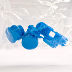 Blue plastic components in a clear plastic bag on a white background