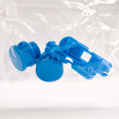 Blue plastic components in a clear plastic bag on a white background