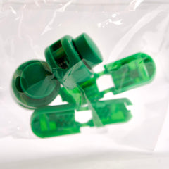 Green plastic components on a white background