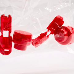 Red plastic components on a white background