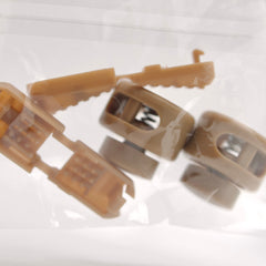 Close-up of brown plastic clips on a white background
