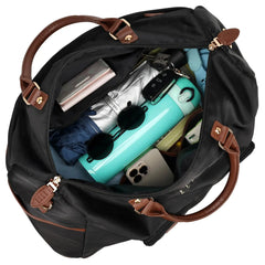 Black duffel bag with brown handles and trim, filled with travel items including a turquoise water bottle and sunglasses.