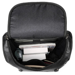 Black backpack with compartments containing electronic devices on a white background