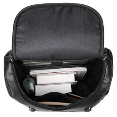 Black backpack with compartments containing electronic devices on a white background