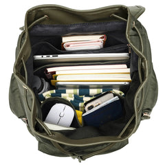 Green backpack with various items including books, a mouse, and a phone inside.