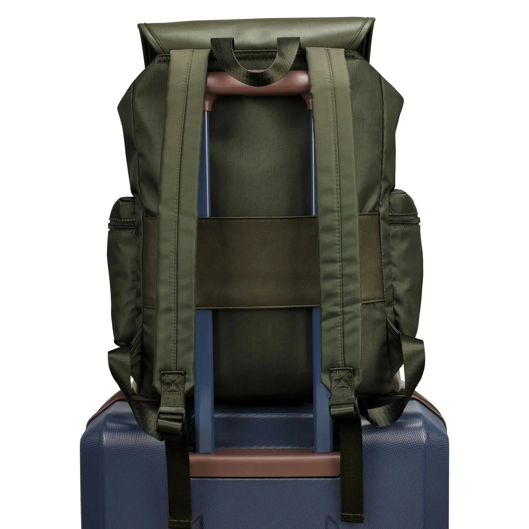 Green backpack on top of a blue suitcase with a white background