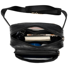 Black crossbody bag with visible contents on a white background