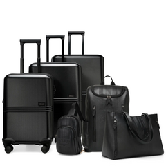 Set of black suitcases and bags on a white background