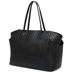 Black quilted handbag on a white background