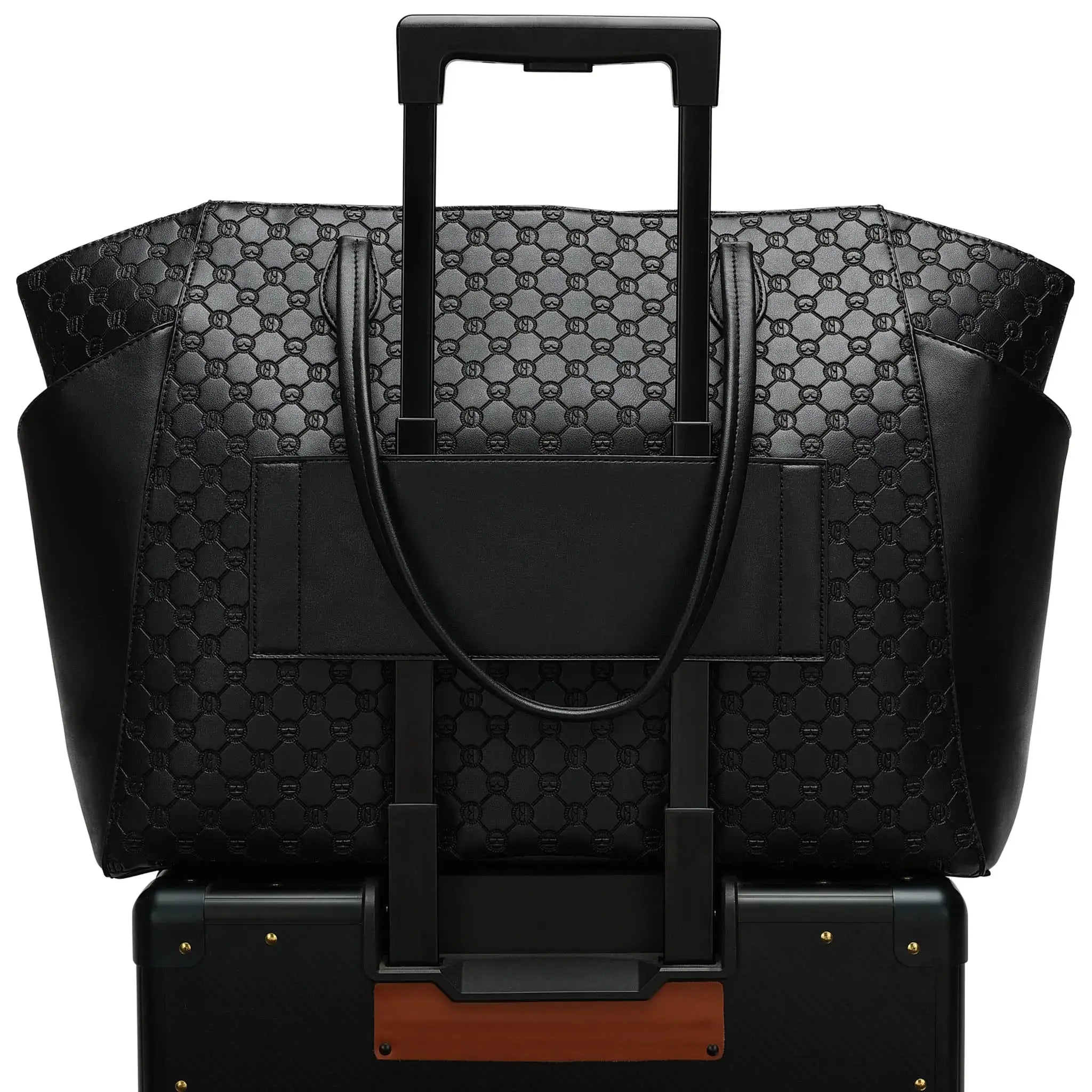 Black patterned suitcase with a matching handbag on a white background