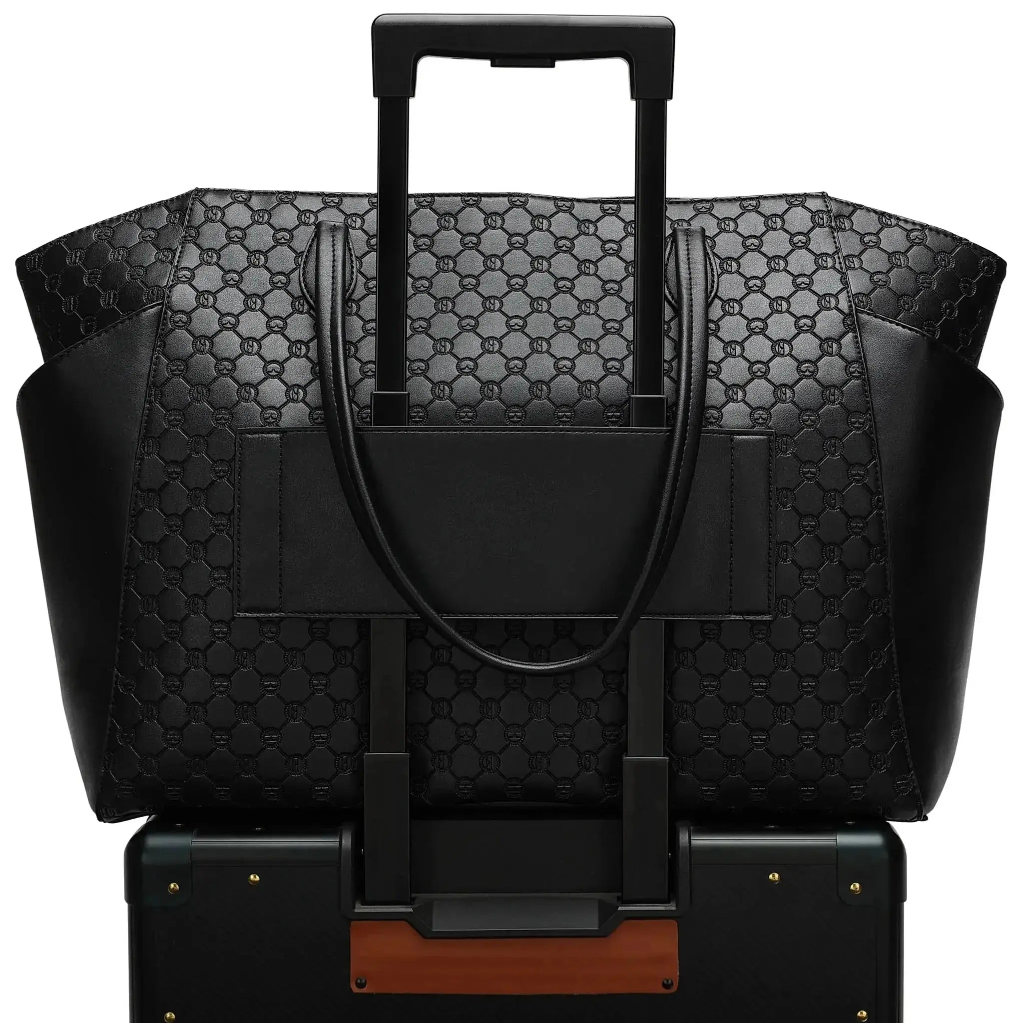 Black patterned suitcase with handle and shoulder strap on a white background