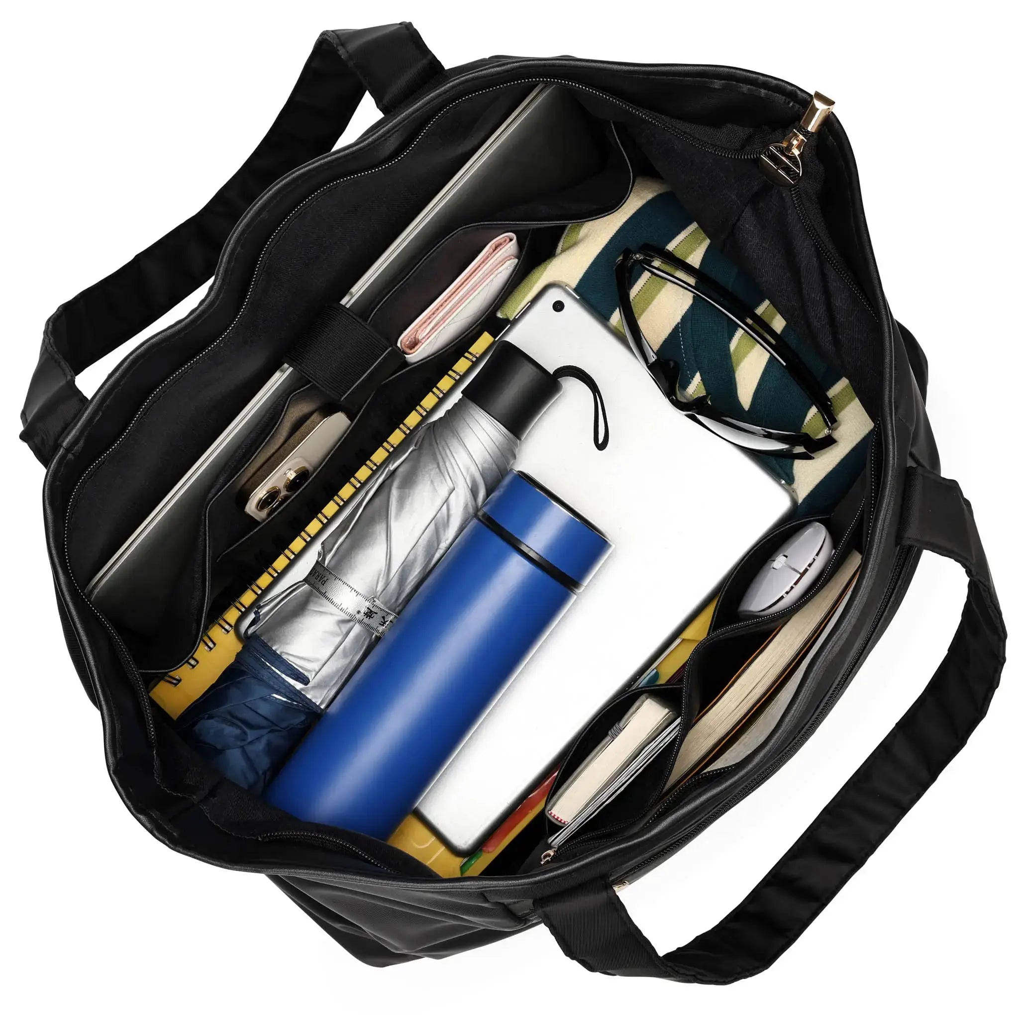 Black bag with various items including a blue water bottle, white phone, and other personal belongings.