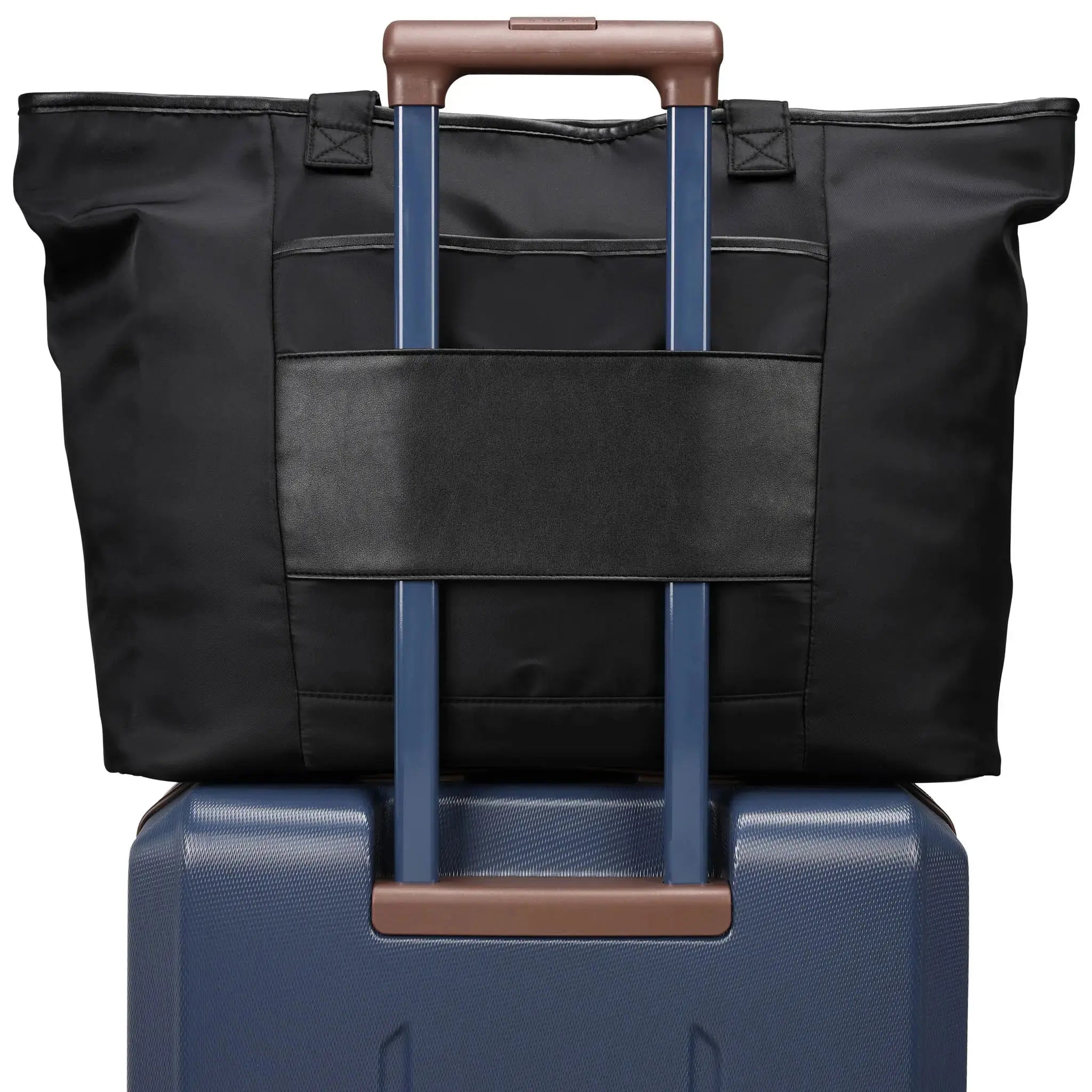 Black bag with blue handle on top of a blue suitcase