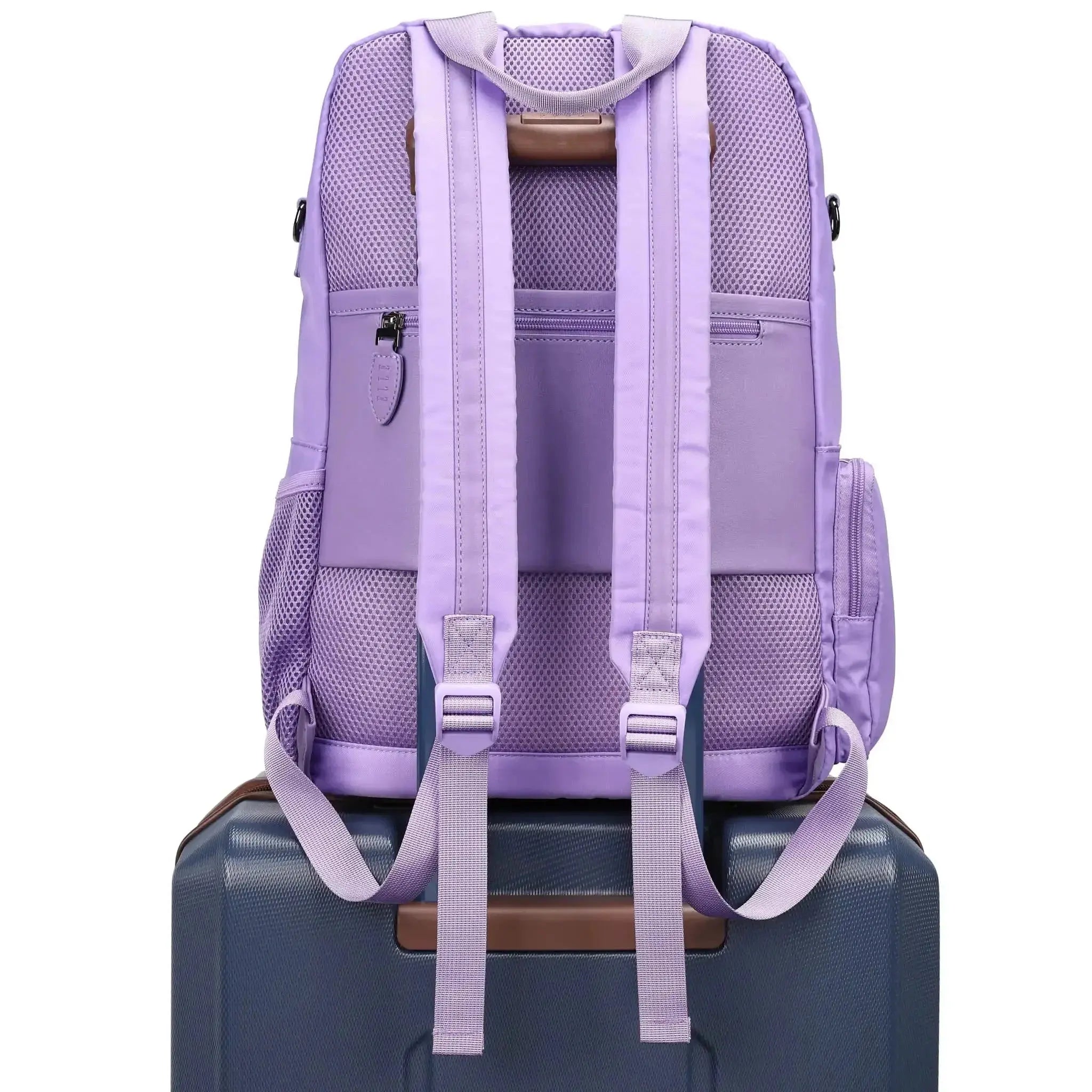 Purple backpack on a suitcase with a white background