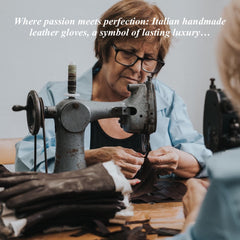 Person working on leather gloves with an old sewing machine, surrounded by leather pieces.