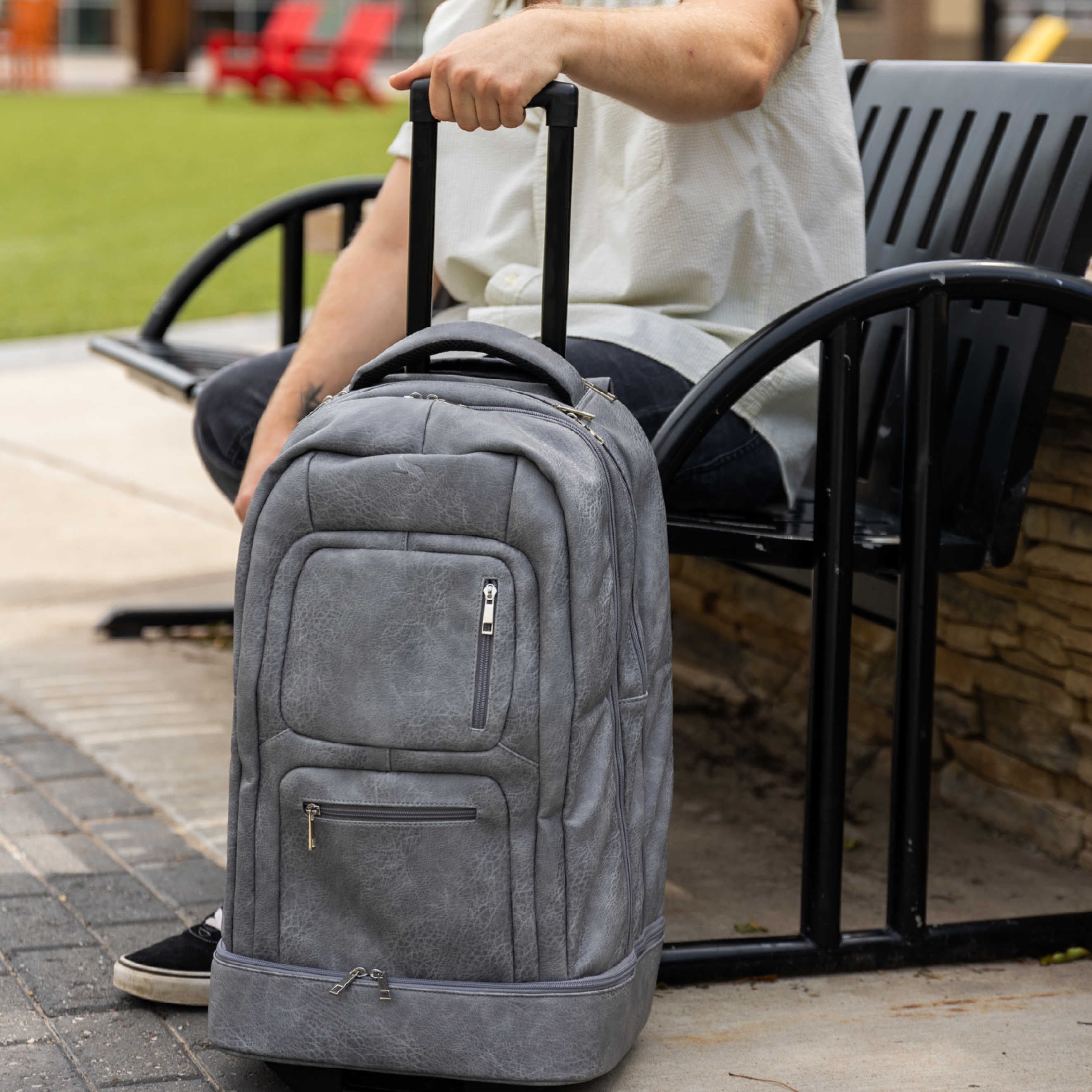Grey Leather Carry-On Patented Roller Bag Sole Premise