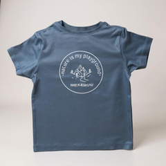 Blue t-shirt with white graphic and text on a light gray background