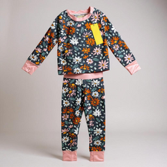 Floral pajama set with pink cuffs on a gray background