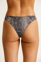 Gray patterned underwear worn by a person on a white background
