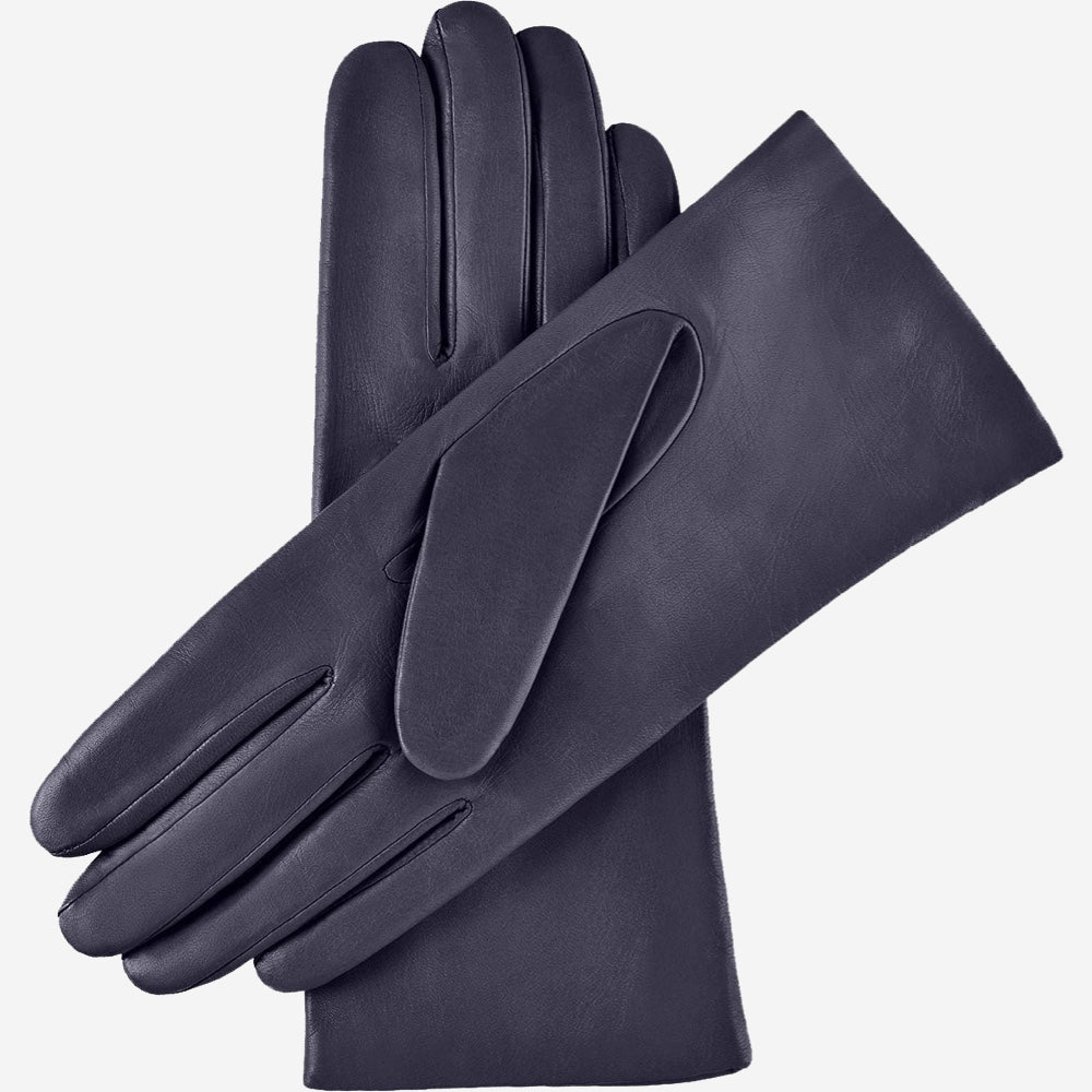 Pair of dark blue leather gloves on a light gray background