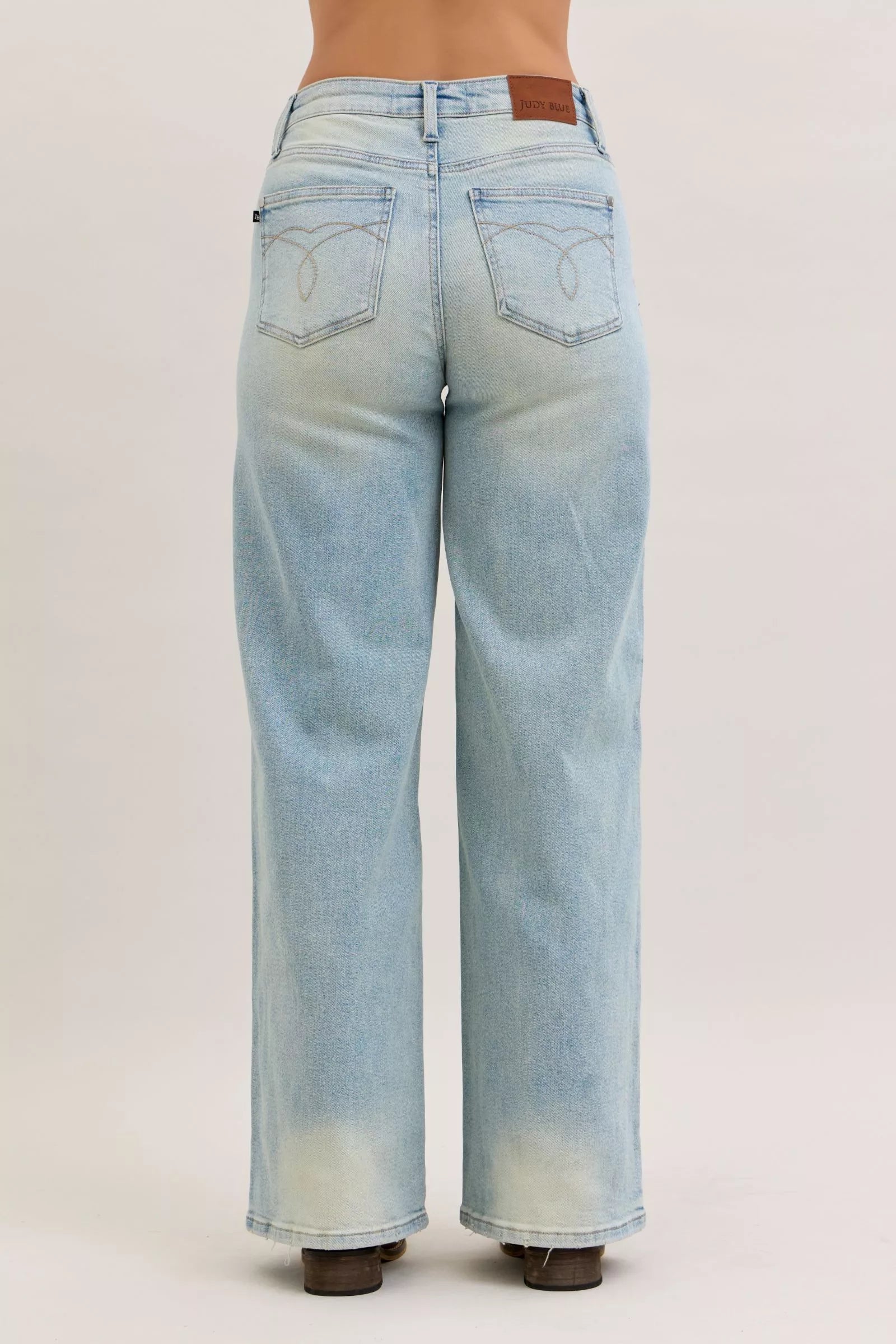 Light blue jeans on a plain background