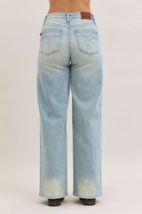 Light blue jeans on a plain background