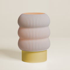 Stool with ribbed design and two-tone color on a beige background