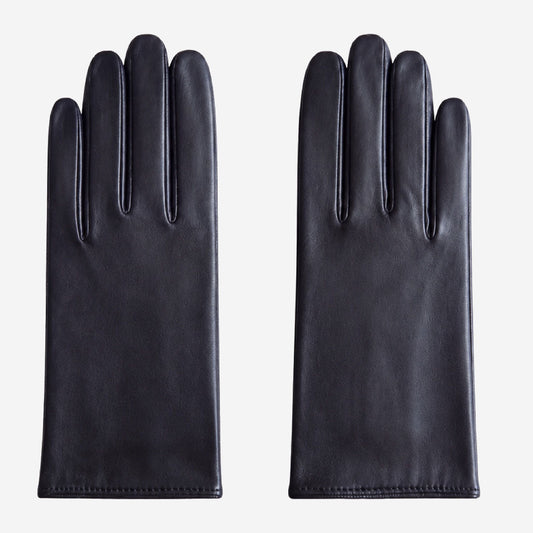 Pair of black leather gloves on a white background