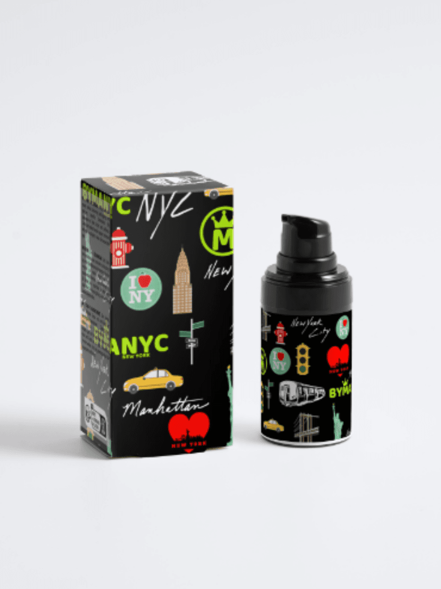 Black bottle and box with New York City-themed graphics on a white background