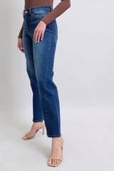 Person wearing blue jeans on a white background