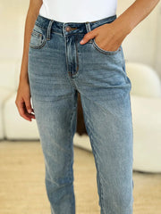 Person wearing blue jeans with a blurred background