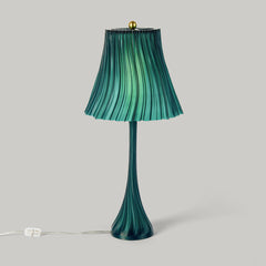 Green pleated lamp with a plain background