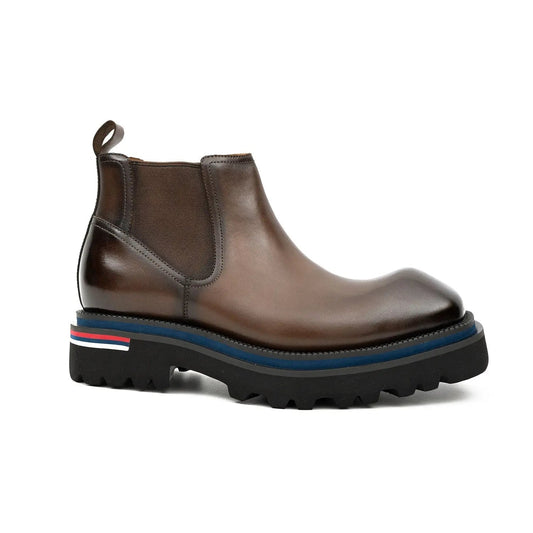Brown leather boot with a striped sole on a white background