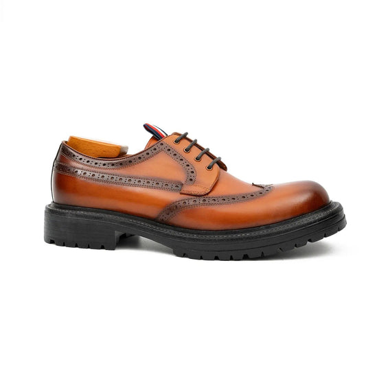 Brown leather dress shoe on a white background