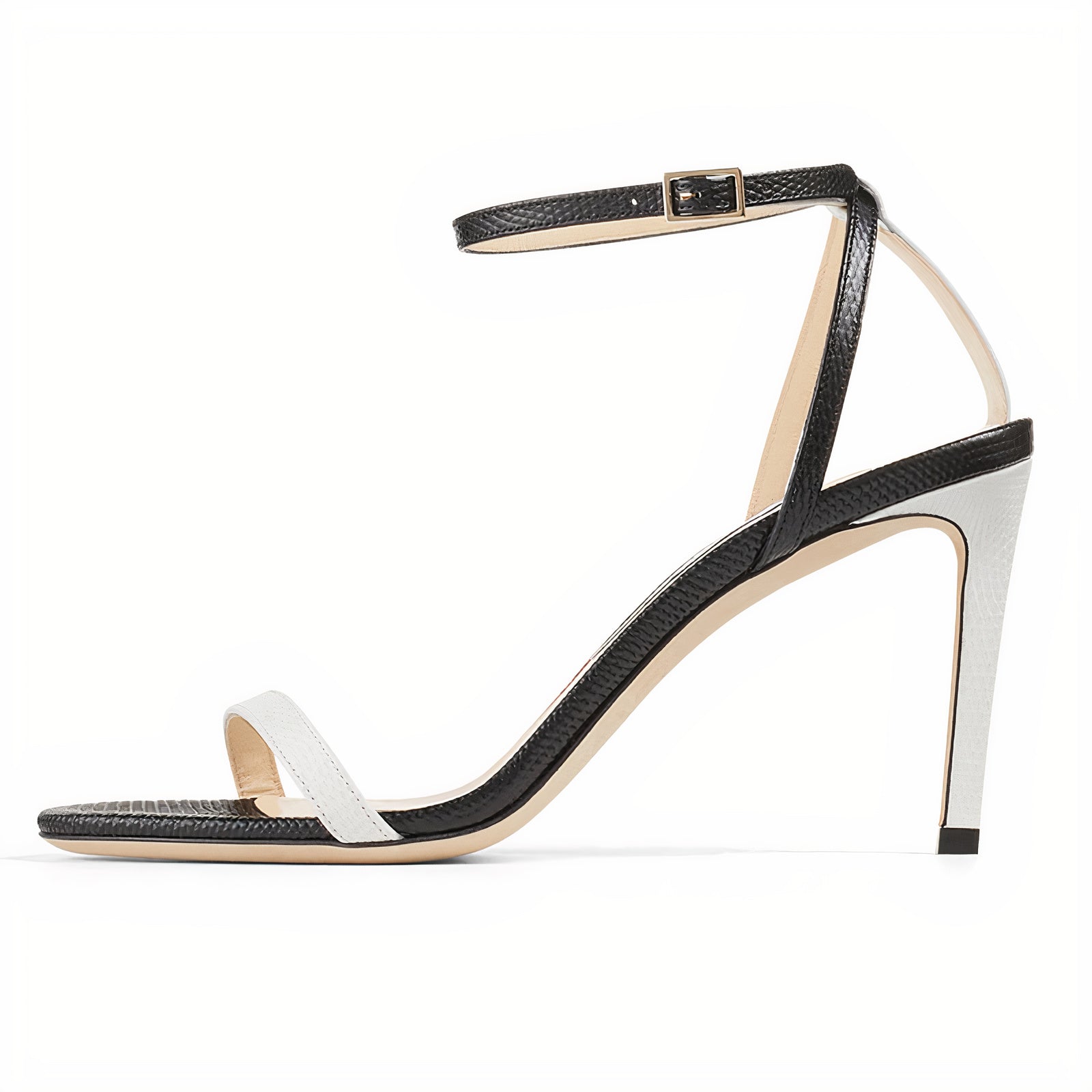 Black and white sandal with thin straps on a white background