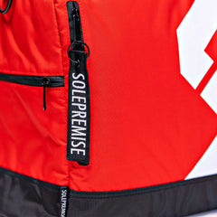 Red Sneaker Duffle Sole Premise