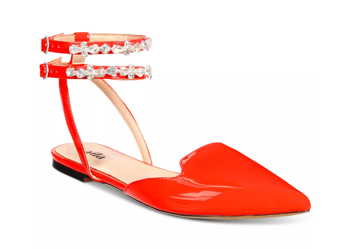 Red flat shoe with ankle straps on a white background