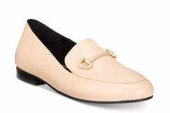 Beige loafer shoe with a gold buckle on a white background