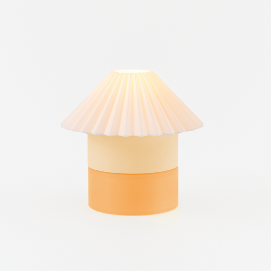 Lamp with a shell-like design on a white background