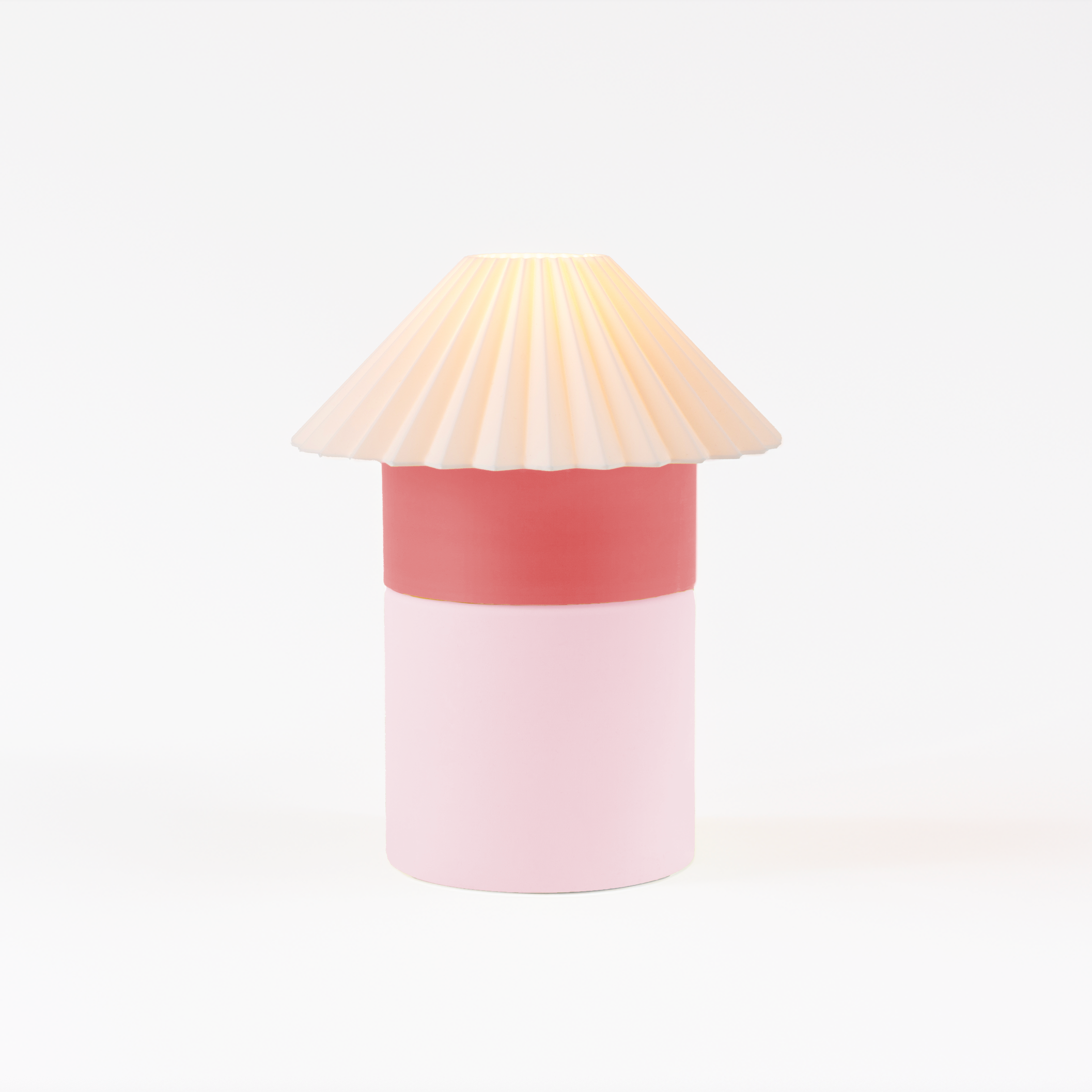 Cylindrical lamp with a pleated shade on a white background