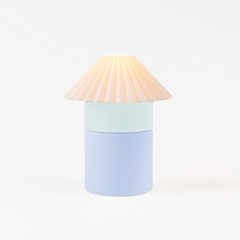 Colorful lamp with a cone-shaped shade on a white background