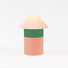 Decorative lamp with a green band and beige shade on a white background