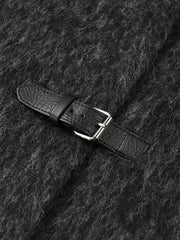Close-up of a dark gray textured fabric with a black leather belt and silver buckle.