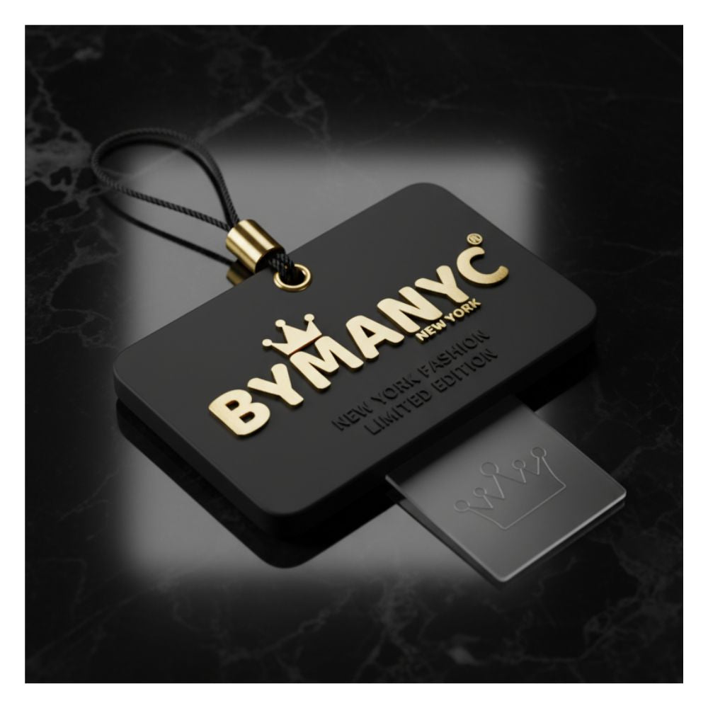 Black and gold branded keychain with 'BYMANYC' on a dark background