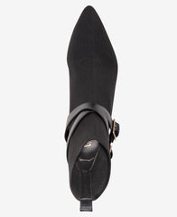 Black pointed-toe boot with a strap on a white background