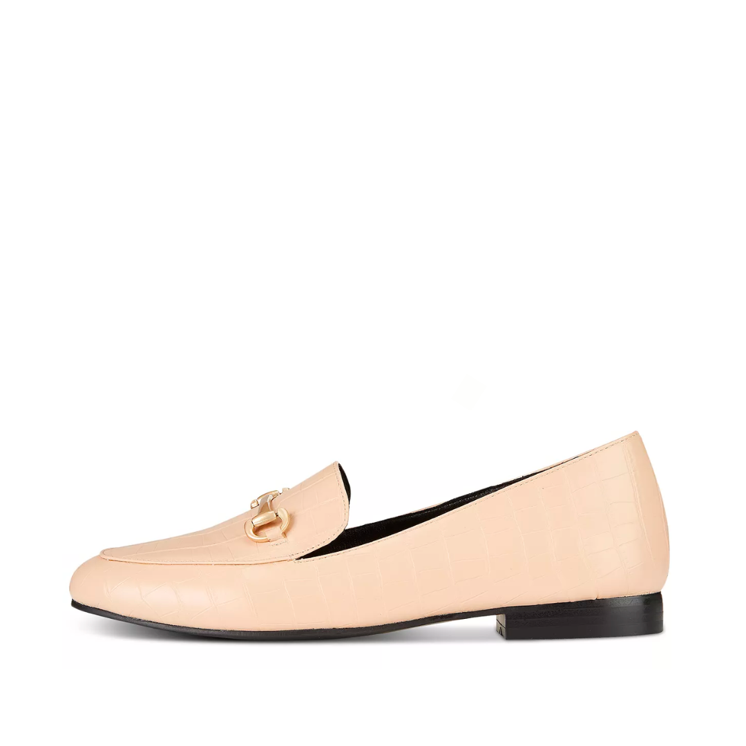 Beige loafer shoe on a white background