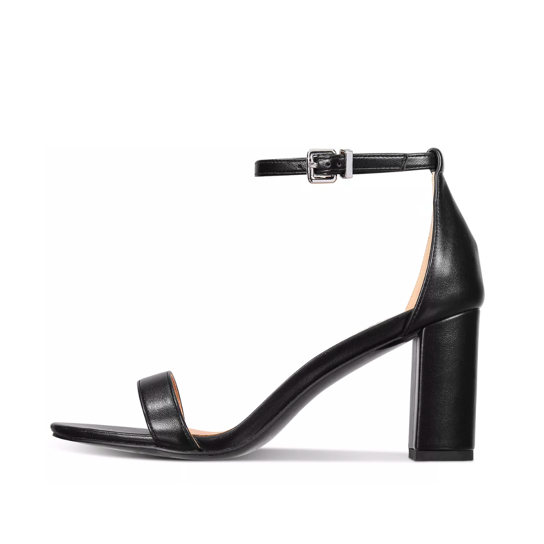 Black sandal with a block heel on a white background