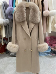 Beige coat with fur accents on a rack in a store setting