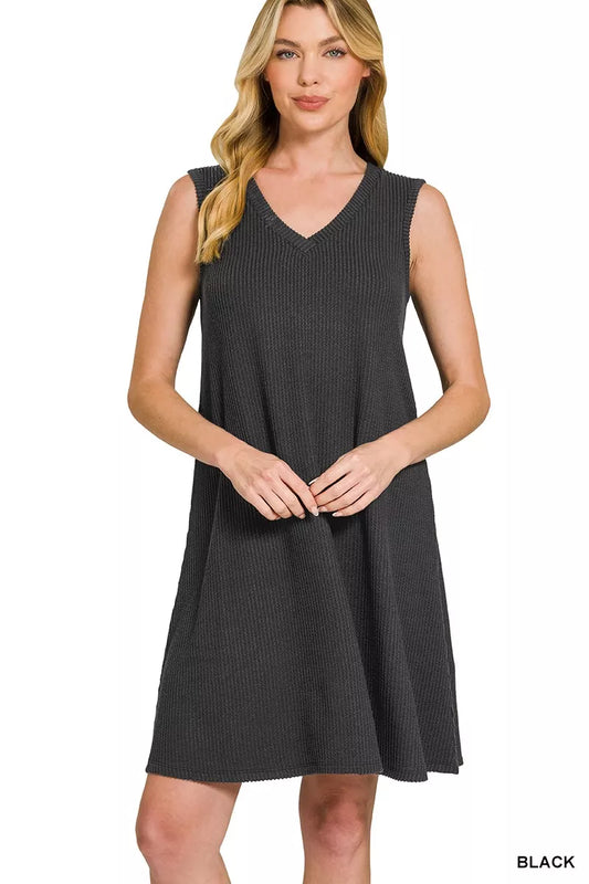 Woman wearing a black sleeveless dress on a white background